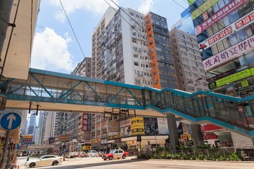 CAUSEWAY BAY, HONG KONG - MAY 30, 2014: Busy high density living with mixed used residential and business street in Hong Kong. Hong Kong has one of the highest and most expensive real estate in the world.