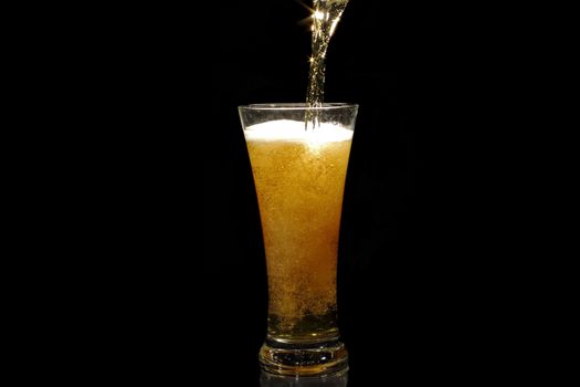 Beer pouring into a glass