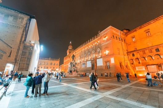 BOLOGNA - OCTOBER 21, 2014: Tourists in city center at night. Bologna is visited by more than 5 million people annually.