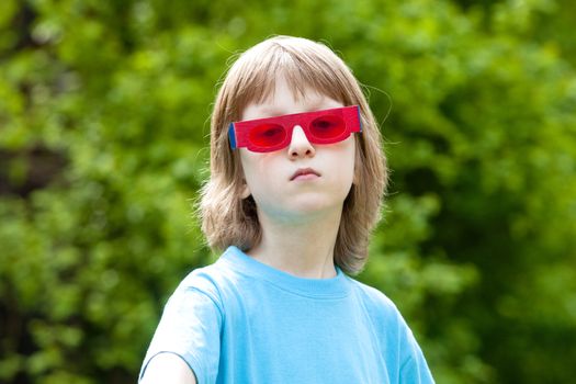 Portrait of a Boy with Funny Red Glasses Looking
