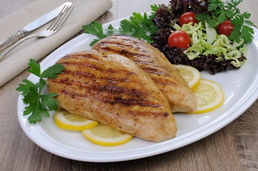 chicken breasts grilled garnish of salad vegetables