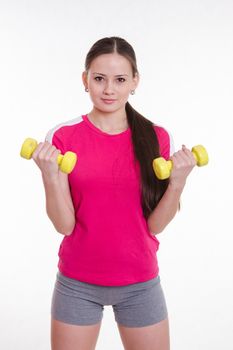 Young beautiful girl holds Europeans physical exercise