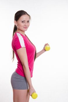 Young beautiful girl holds Europeans physical exercise
