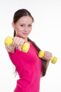 Young beautiful girl holds Europeans physical exercise