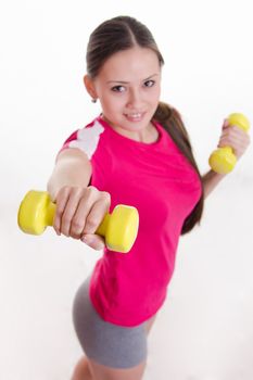 Young beautiful girl holds Europeans physical exercise