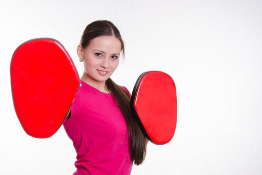 Young beautiful girl holds Europeans physical exercise