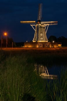 Authentic renovated windmill in Winterswijk in the east of the Netherlands in special illumination