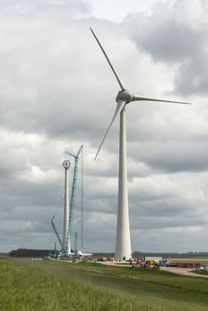 Construction of a modern windmill in the Noordoostpolder near the dyke of the IJsselmeer in Netherlands