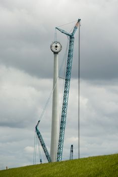 Construction of a modern windmill in the Noordoostpolder near the dyke of the IJsselmeer in Netherlands