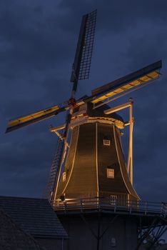 Authentic renovated windmill in Winterswijk in the east of the Netherlands in special illumination during in the beginning of the evening.