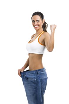 Woman with large jeans in dieting concept