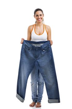 Woman with large jeans in dieting concept