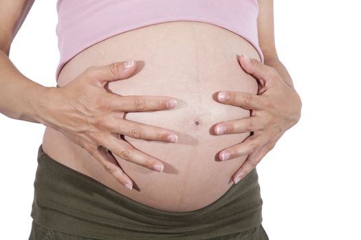 front of naked paunch eight month pregnant woman with her two hands on isolated over white background