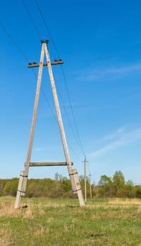 High voltage transmission lines on wooden poles