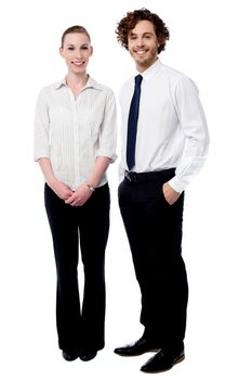 Full length of business couple posing together