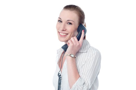 Smiling woman answering a phone call 