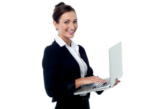 Smiling business woman posing with laptop