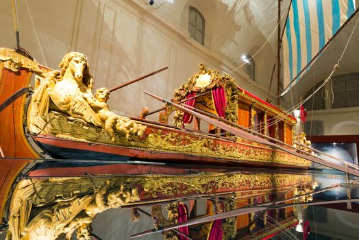 TURIN, ITALY - APRIL 4, 2015: the Bucentaur (Bucintoro), ancient Venetian galley, created in Venice by Vittorio Amedeo II between 1729 and 1731. Exposed in the Venaria Reale in Turin, Piedmont, Italy.