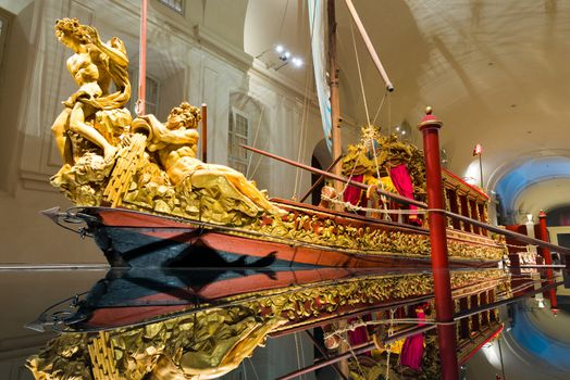 TURIN, ITALY - APRIL 4, 2015: the Bucentaur (Bucintoro), ancient Venetian galley, created in Venice by Vittorio Amedeo II between 1729 and 1731. Exposed in the Venaria Reale in Turin, Piedmont, Italy.