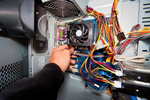 PC service and repair..  Inside of the personal computer: power suplay motherboard, cables, discs, fan...