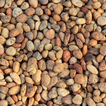 Pile of round peeble stones for background