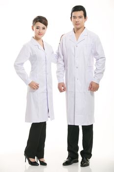 Staff wear coats in front of white background