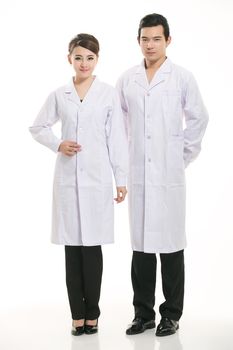 Staff wear coats in front of white background