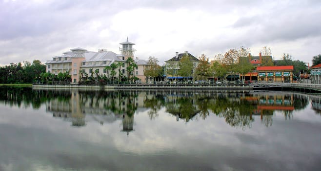 Reflections in the lake of buildings in a town