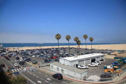 Beach goers and parking near the famous Santa Monica Pier.