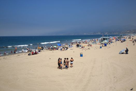 A family on the beach in Santa Monica, California.