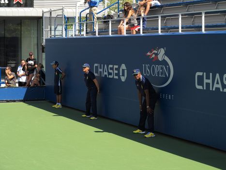 US Open Linesman and lineswoman on a side court at the Billie Jean King Tennis Center.