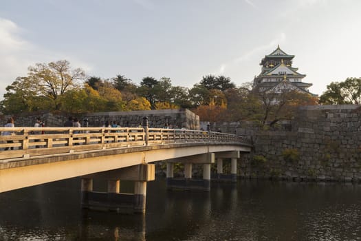 This photo was shot from Osaka Castle, Japan in the evening. The soft sunlight touch the castle is so beautiful.