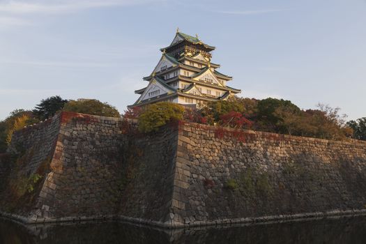 This photo was shot from Osaka Castle, Japan in the evening. The soft sunlight touch the castle is so beautiful. 