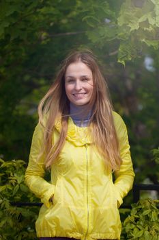 Portrait of beautiful smiling  girl against green park.