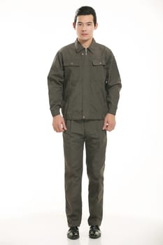 The young engineer various occupation clothing standing in front of a white background