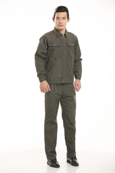The young engineer various occupation clothing standing in front of a white background