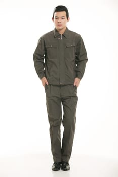 The young engineer various occupation clothing standing in front of a white background