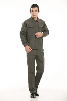 The young engineer various occupation clothing standing in front of a white background