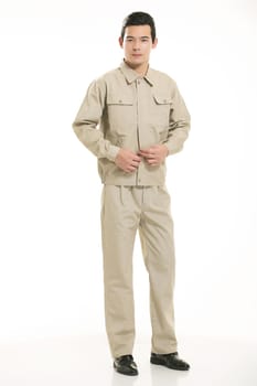 The young engineer various occupation clothing standing in front of a white background