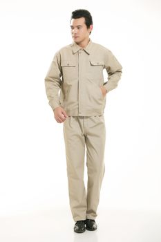 The young engineer various occupation clothing standing in front of a white background