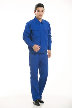 The young engineer various occupation clothing standing in front of a white background