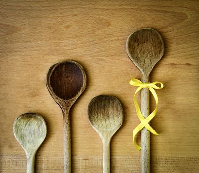 background spoons family with yellow ribbon bow