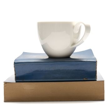 stack of book and coffee cup isolated on white background