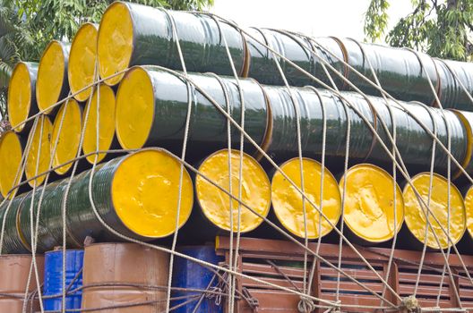 colorful metal oil barrels stacked  for cargo in India