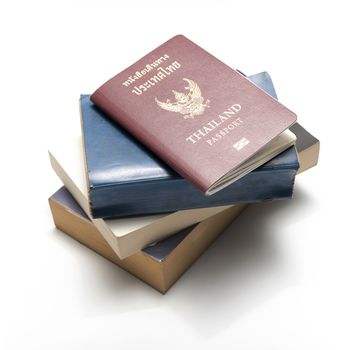 stack of book and passport isolated on white background