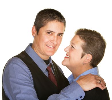 Cheerful lesbian couple embracing over isolated background