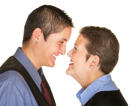 Laughing Caucasian lesbian couple facing each other