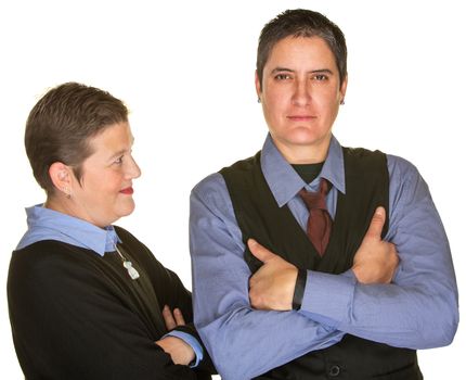 Mature woman looking at butch girlfriend in necktie