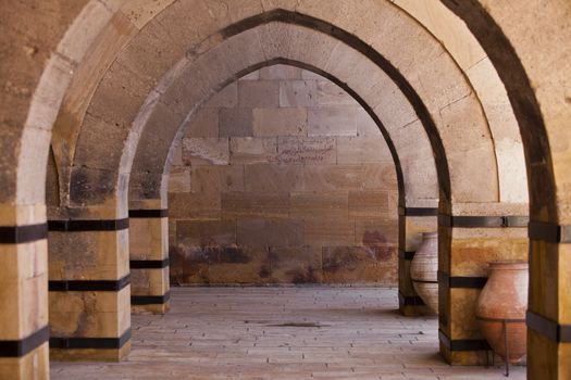 Arches and welcoming wall inscription on historic Turkish building