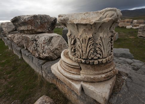 Remains of base and cap from Corinthian style column at Antioch Pisidian in Turkey